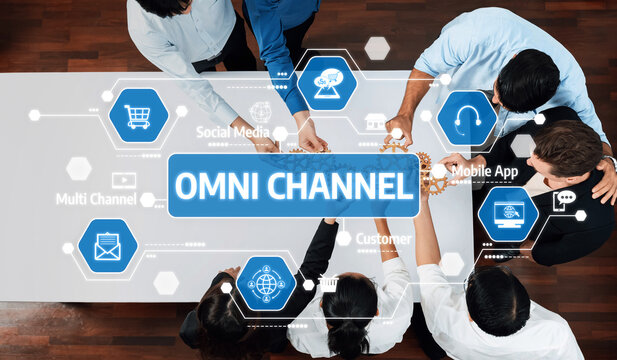 A diverse team collaborates on innovative omni channel strategies to enhance customer engagement in a modern business environment, showcasing interactive approaches and tools. Amity