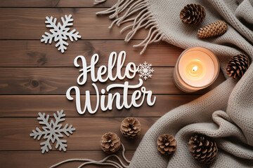 Cozy winter scene with candle snowflakes pine cones and a warm scarf on a wooden background creating a festive and inviting atmosphere.