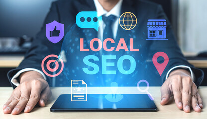 Business professional focuses on local SEO in a modern office, surrounded by digital marketing icons, emphasizing digital strategies and growth opportunities. Gantry