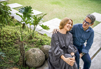 Mature couple sharing happy moment in garden
