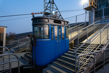 Industrial port crane cabin with stairs in evening light
