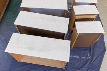 Dresser Drawers Being Refinished in DIY Project
