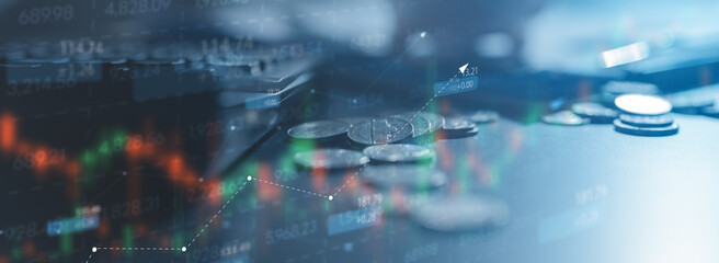 A financial stock market background featuring coins, digital trading charts, and rising trend lines. Represents investment analysis, market performance, financial data, economic and digital trading.