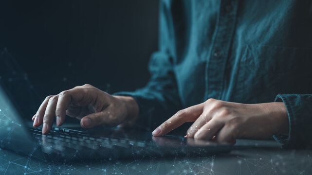 Hands typing on a laptop with abstract digital connections and neural network graphics, representing modern technology, data processing, and the concept of artificial intelligence in a futuristic.