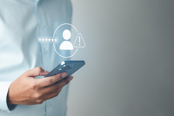 login, activity, devices, session, history, account, security, A person checks a mobile phone displaying a security alert related to login activity and identity protection.