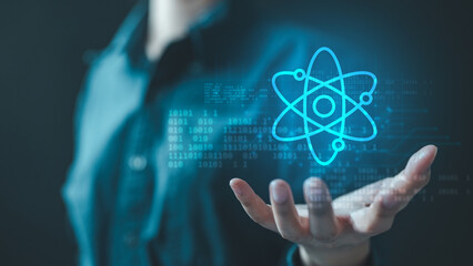 quantum, computing, ai, data, code, network, algorithm, A glowing quantum atom icon floats above a person's hand, symbolizing advanced computing, AI, and futuristic scientific innovation.