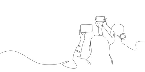 Two women are using smartphones to take photos in one continuous line. simple linear style. Doodle vector illustration Editable stroke.