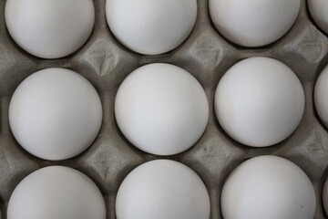 These are white eggs in an egg carton.