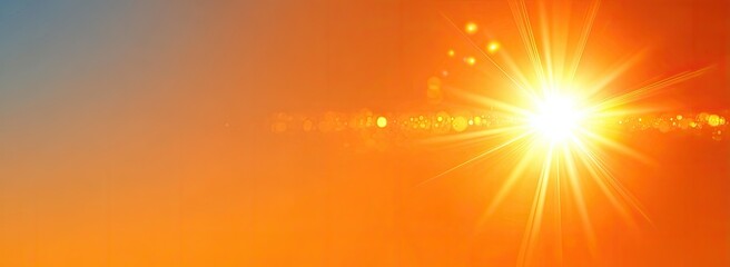 Bright sunburst with lens flare over orange gradient background