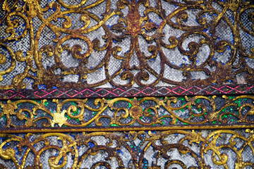 Ornate Antique Metalwork with Intricate Patterns and Colorful Details