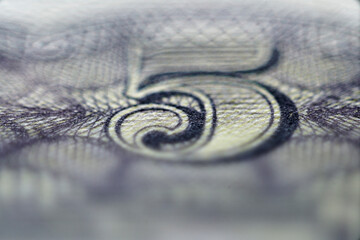 Close-Up View of a Five Dollar Bill Showing Intricate Detail