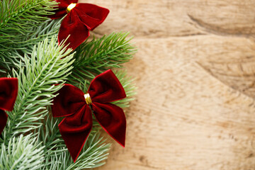 Red ribbons with pine branches, Christmas tree concept.