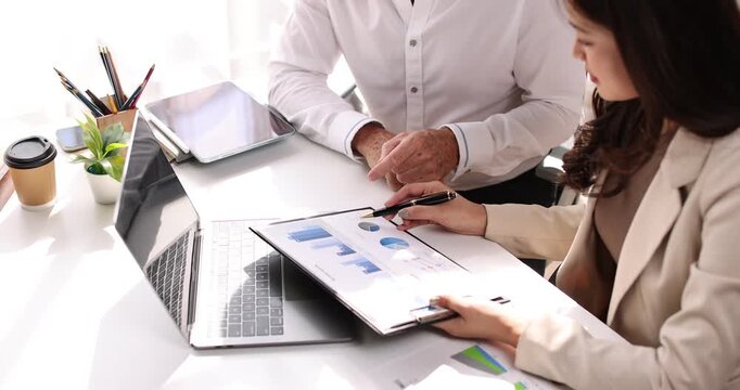 Team of business analysis documents in action office setting report generation professional environment strategic planning
