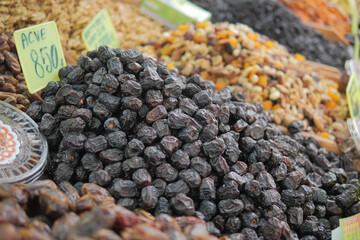 Dried fruits and nuts displayed in a market stall