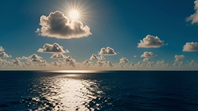 Bright sun path reflecting on a tranquil blue ocean under a clear sky with scattered white clouds ideal for backgrounds