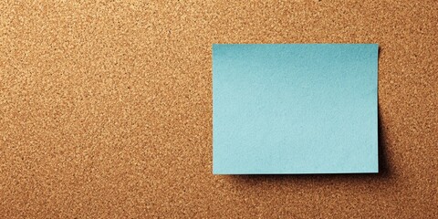 Fototapeta premium The Blue Sticky Note On A Cork Bulletin Board With Blank Copyspace For Message