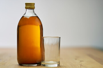 apple cider vinegar on table top.