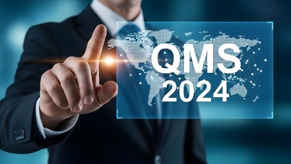 Businessman touching a digital screen displaying qms 2024 with a world map overlay, representing quality management system implementation and global strategy in the current year