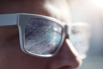 Smart glasses projecting AR navigation map in front of user, wearables innovation concept