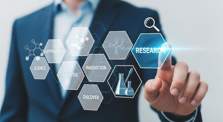A businessman in a blue suit interacts with a virtual research interface, displaying molecule graphics and lab equipment icons. Focus on modern technology.