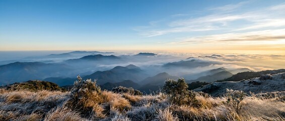 Fototapeta premium Sunrise over Frosted Mountains and a Sea of Clouds