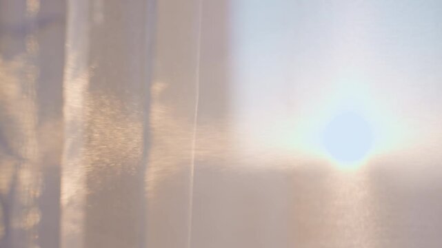 Morning Light Ambiance, Gentle Sunrise With Floating Particles, Soft Glow Through Textured Curtains At Dawn, Sunrise Filters Softly Across Textured Fabric Curtain With Dust Motes And Subtle Bokeh