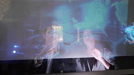 Young AI technician reviewing AI data visualization and neural networks platforms, smart technology cyberspace systems. Studies machine learning, cloud computing and algorithms - Powered by Adobe