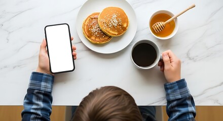 young woman holding coffee cup in cafe with laptop and tablet on table, mock up