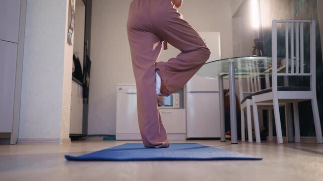Foot Positioning Balance, Woman Practicing Tree Pose, Grounding Stance Of Woman Practicing Tree Pose Indoors, Detailed View Of Foot Placement And Subtle Weight Shifts During Yoga Balancing Exercise