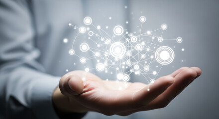 Open palm showcasing a network of glowing nodes symbolizing digital connection and innovative technology on soft light gray backdrop perfect as background.