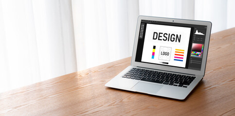 Graphic designer software for modern design of web page and commercial ads showing on the computer screen