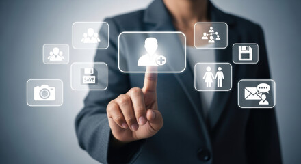 A woman in a gray blazer touches a virtual person icon on a gray interface screen, representing digital contact, communication, and business technology.