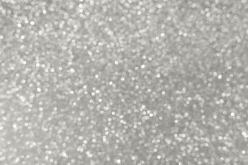 Shimmering silver glitter background with bokeh lights for festive and glamorous design Demonstration Color of the Year 2026