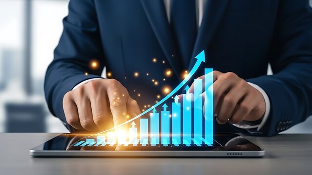 Businessman interacting with a digital tablet displaying a rising blue bar chart and growth arrow - Powered by Adobe