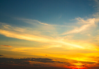 Fototapeta premium Sky sunset evening sunrise cloud weather dramatic landscape goldent and indigo color gradient pastel horizon, twilight yellow golden reflection morning nature environment energy ecosystem change