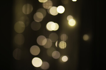 Blurry Bokeh Lights in Dark Background for Abstract and Festive Holiday Designs