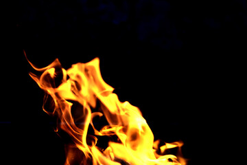 Fototapeta premium Background of the flame in the oven. Tongues of fire in a fireplace. Fire texture.