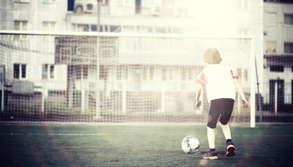 Sports in the stadium. Sports Equipment. Warming up the player before the game. Child Game.