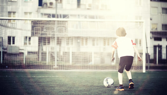 Sports in the stadium. Sports Equipment. Warming up the player before the game. Child Game. - Powered by Adobe