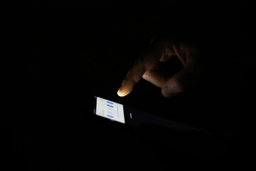 Hand Using Smartphone in Dark Room with Low Light - Technology, Touchscreen, Nighttime, Communication, Interaction
