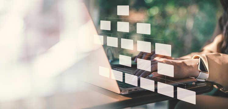 Digital Workflow Management in Modern Workspace, A person works on laptop in a bright, modern environment, with digital interface overlay representing workflow automation or organizational structure. 