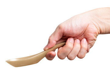 Male hand holding a gold plastic spoon isolated on white background.