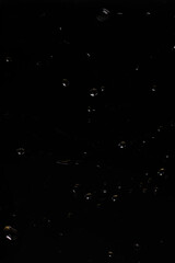 Falling Water Droplets on Black Background - Abstract Liquid Motion