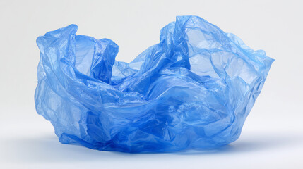 Fototapeta premium Blue plastic bag isolated on white background. Simple object shot representing packaging, retail use, waste concept, and environmental pollution issues.