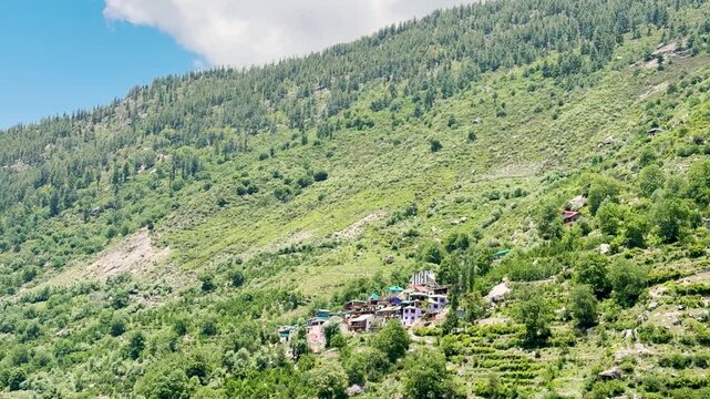 4K Landscape shot of a small village on the Himalayan mountain range as seen on the way to Killar in Chamba district, Himachal Pradesh, India. Scenic view of beautiful village in the mountains.