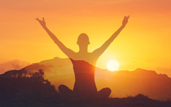 Woman Silhouette Arms Raised at Sunrise &ndash; Freedom, Meditation, Success Concept