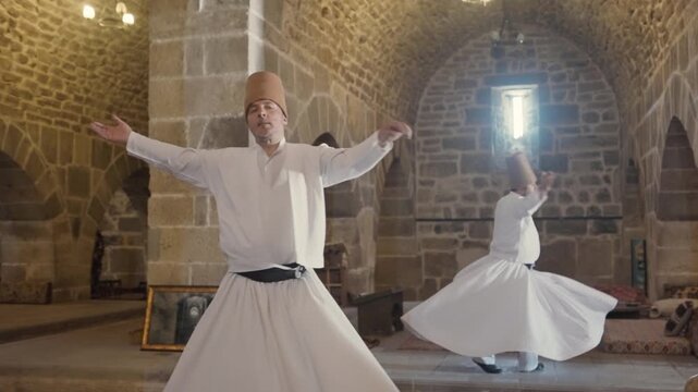 Two sufi whirling Dervish dancers in traditional dress, Konya, Turkey