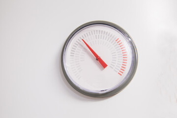 Analog gauge with red arrow of water heater boiler on white background