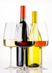 Naklejka premium Different wine bottles and glasses on white background