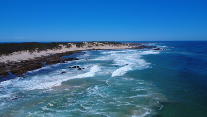 Aerial view of the ocean, beach and nature reserve